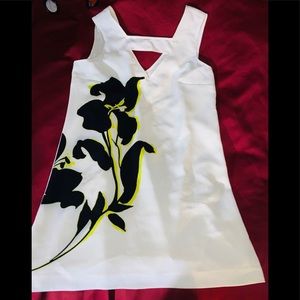 Off-white sheath dress with large flower in front